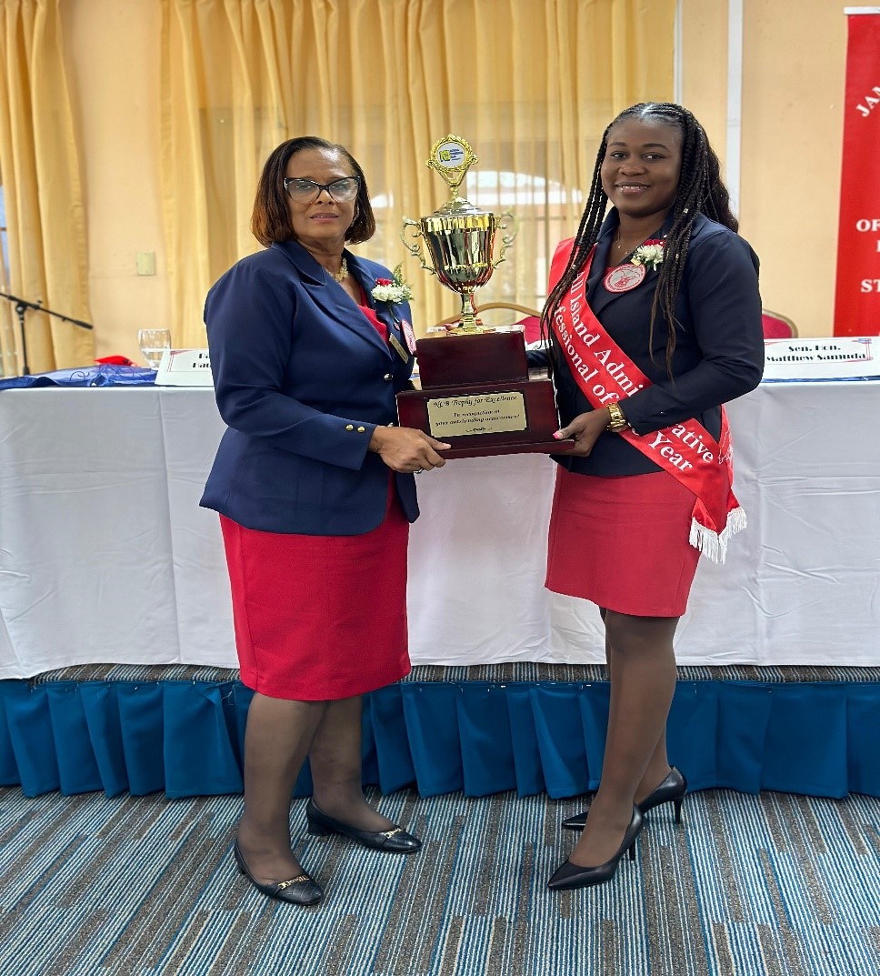 Sanieta Gayle Henry (right) receiving the Trophy for Excellence as the 2024 All Island Administrative Professional from Mrs Paulett Henry-Lynch-President of the St Ann Chapter of Administrative Professionals (left) at an awards ceremony for the chapter, at the Cardiff Hotel and Spa, Runaway Bay, St Ann, on Wednesday April 24.  