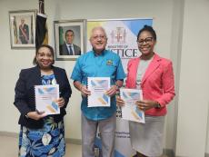 Minister of Justice, Hon. Delroy Chuck (centre); Permanent Secretary at the Ministry, Mrs Grace Ann Stewart McFarlane (left) and CEO/Administrator-General, Mrs Stacie-Ann Carty (right) pose with copies of the AGD’s Strategic Plan for 2024/2025-2027/2028 at the Ministry’s head office on Wednesday, July 11, 2024. 