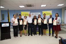 Justice Minister, Delroy Chuck, posing for a photograph with the eight newly commissioned notaries public during a brief ceremony at the Ministry on July 25, 2025.  